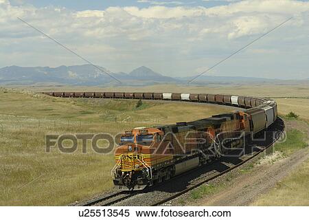 Stock Photography -  Browning, MT, Montana, Rocky Mountains, Blackfeet Indian Reservation, BNSF, freight train. Fotosearch