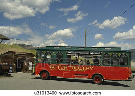 Stock Image -  Butte, MT, Montana, Berkeley Pit, old open pit mine, Old #1 Butte Trolley. Fotosearch