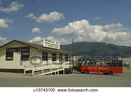Stock Image -  Butte, MT, Montana, Berkeley Pit, Visitor Center, old open pit mine, Old #1 Butte Trolley. Fotosearch