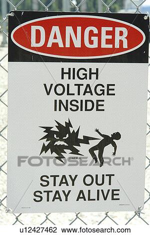 Stock Image -  Clark Fork, ID, Idaho, Cabinet Gorge Dam, hydroelectric development, Clark Fork River, Danger High Voltage sign. Fotosearch