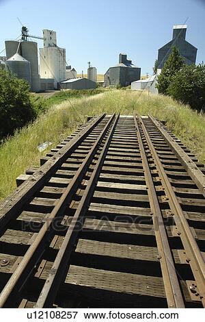 Stock Photo -  Cottonwood, ID, Idaho, Camas Prairie, Railroad on Stilts, train tracks, grain elevators. Fotosearch