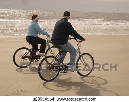 couple biking on the beach, Hilton Head Island, Low Country, South Carolina, SC, Atlantic Ocean View Large Photo Image Picture - couple biking on the beach, Hilton Head Island, Low Country, South Carolina, SC, Atlantic Ocean. Fotosearch