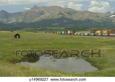 East Glacier Park, MT, Montana, Rocky Mountains, Blackfeet Indian Reservation, freight train View Large Photo Image Stock Photo - East Glacier Park, MT, Montana, Rocky Mountains, Blackfeet Indian Reservation, freight train. Fotosearch