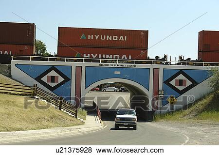 Stock Photo -  East Glacier Park, MT, Montana, Rocky Mountains, Blackfeet Indian Reservation, railroad bridge. Fotosearch