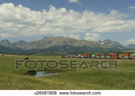 East Glacier Park, MT, Montana, Rocky Mountains, Blackfeet Indian Reservation, freight train View Large Photo Image Stock Photo - East Glacier Park, MT, Montana, Rocky Mountains, Blackfeet Indian Reservation, freight train. Fotosearch