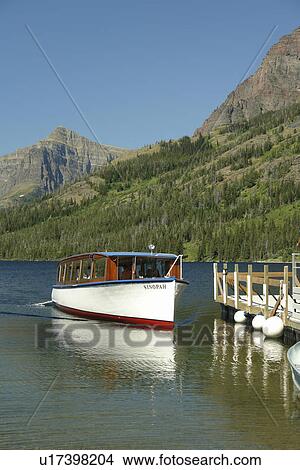 Glacier National Park, MT, Montana, Rocky Mountains, Two Medicine Lake, excursion boat View Large Photo Image Picture - Glacier National Park, MT, Montana, Rocky Mountains, Two Medicine Lake, excursion boat. Fotosearch