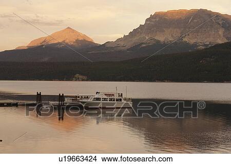 Glacier National Park, MT, Montana, Rocky Mountains, Going to the Sun Road, St. Mary Lake, Rising Sun Boat Landing, excursion boat, sunset View Large Photo Image Picture - Glacier National Park, MT, Montana, Rocky Mountains, Going to the Sun Road, St. Mary Lake, Rising Sun Boat Landing, excursion boat, sunset. Fotosearch
