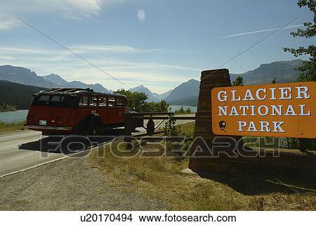 Glacier National Park, MT, Montana, Rocky Mountains, Many Glacier Region, Entrance Sign, red jammer tour bus View Large Photo Image Picture - Glacier National Park, MT, Montana, Rocky Mountains, Many Glacier Region, Entrance Sign, red jammer tour bus. Fotosearch
