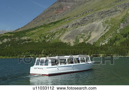 Glacier National Park, MT, Montana, Rocky Mountains, Many Glacier Region, Many Glacier Hotel, Swiftcurrent Lake View Large Photo Image Stock Image - Glacier National Park, MT, Montana, Rocky Mountains, Many Glacier Region, Many Glacier Hotel, Swiftcurrent Lake. Fotosearch