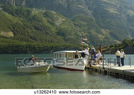 Glacier National Park, MT, Montana, Rocky Mountains, Going to the Sun Road, St. Mary Lake, Rising Sun Boat Landing, excursion boat View Large Photo Image Stock Image - Glacier National Park, MT, Montana, Rocky Mountains, Going to the Sun Road, St. Mary Lake, Rising Sun Boat Landing, excursion boat. Fotosearch