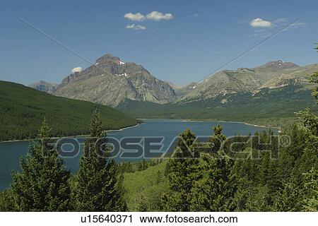 Stock Image -  Glacier National Park, MT, Montana, Rocky Mountains, Lower Two Medicine Lake. Fotosearch