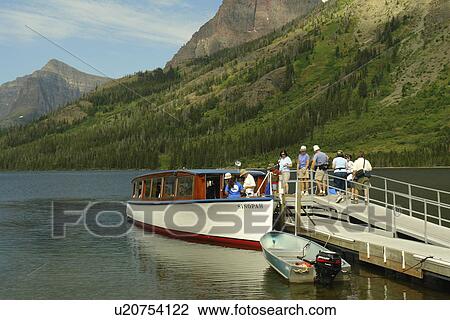 Stock Image -  Glacier National Park, MT, Montana, Rocky Mountains, Two Medicine Lake, excursion boat. Fotosearch