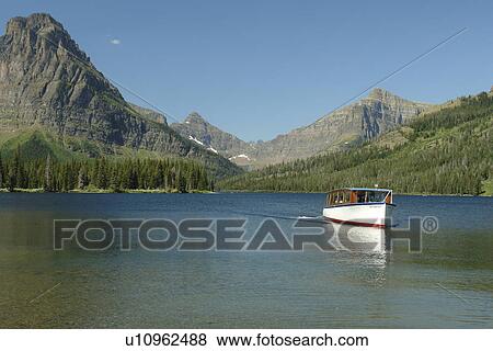 Glacier National Park, MT, Montana, Rocky Mountains, Two Medicine Lake, excursion boat View Large Photo Image Stock Photo - Glacier National Park, MT, Montana, Rocky Mountains, Two Medicine Lake, excursion boat. Fotosearch