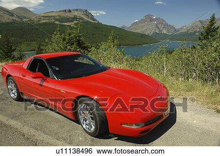 Glacier National Park, MT, Montana, Rocky Mountains, Lower Two Medicine Lake, overlook, red corvette View Large Photo Image Stock Photograph - Glacier National Park, MT, Montana, Rocky Mountains, Lower Two Medicine Lake, overlook, red corvette. Fotosearch