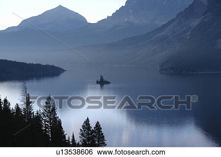 Stock Photograph -  Glacier National Park, MT, Montana, Rocky Mountains, Going to the Sun Road, St. Mary Lake, sunrise. Fotosearch