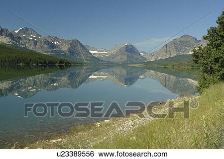 Glacier National Park, MT, Montana, Rocky Mountains, Many Glacier Region, Lake Sherburne View Large Photo Image Stock Photograph - Glacier National Park, MT, Montana, Rocky Mountains, Many Glacier Region, Lake Sherburne. Fotosearch