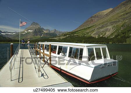 Glacier National Park, MT, Montana, Rocky Mountains, Many Glacier Region, Many Glacier Hotel, Swiftcurrent Lake View Large Photo Image Stock Photography - Glacier National Park, MT, Montana, Rocky Mountains, Many Glacier Region, Many Glacier Hotel, Swiftcurrent Lake. Fotosearch