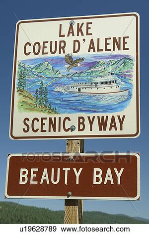 Stock Photo -  Harrison, ID, Idaho, Lake Coeur D' Alene Scenic Byway, Beauty Bay, road sign. Fotosearch