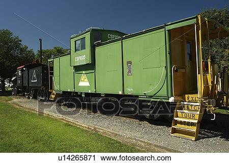 Stock Image -  Lewiston, ID, Idaho, city park, train, steam locomotive, green caboose. Fotosearch
