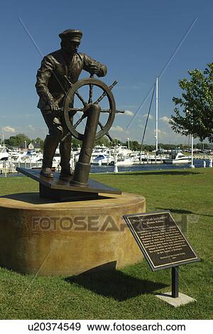Stock Photo -  Ludington, MI, Michigan, Lake Michigan, waterfront, municipal marina, park, Spirit Of Ludington statue. Fotosearch