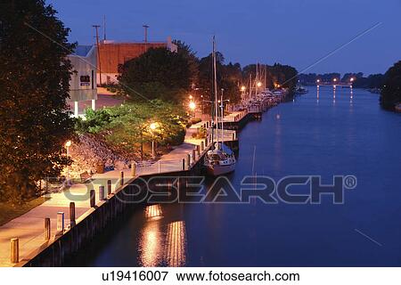 Stock Photo -  Manistee, MI, Michigan, Lake Michigan, Manistee River, waterfront, evening. Fotosearch