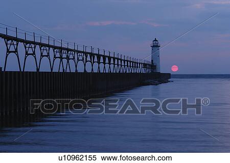 Stock Photography -  Manistee, MI, Michigan, Lake Michigan, North Pierhead Lighthouse, sunset. Fotosearch