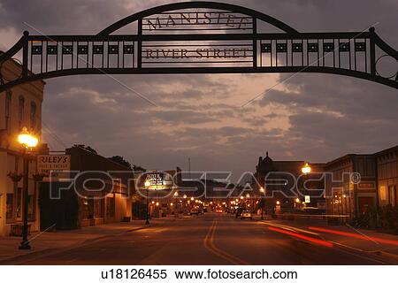 Stock Photography -  Manistee, MI, Michigan, River Street, Historic Downtown, evening. Fotosearch