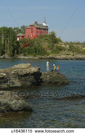 Stock Photography -  Marquette, MI, Michigan, Upper Peninsula, Lake Superior, U. S. Coast Guard Lighthouse 1866, Lighthouse Point, Marquette Maritime Museum. Fotosearch