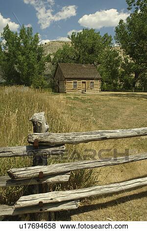 Stock Photo -  Medora, ND, North Dakota, Theodore Roosevelt National Park, South Unit, Visitor Center, Teddy Roosevelt's first ranch Maltese Cross log cabin. Fotosearch