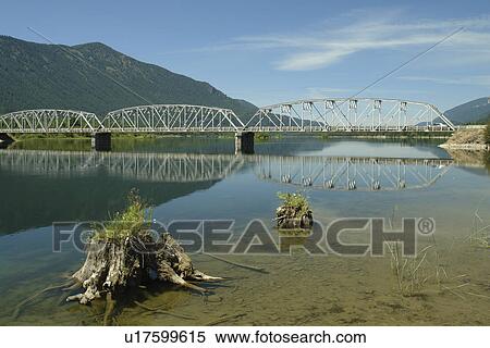 Stock Photography -  MT, Montana, Noxon Reservoir, Clark Fork River, bridge. Fotosearch