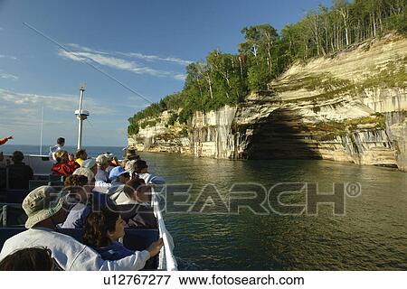Munsing, MI, Michigan, Upper Peninsula, Lake Superior, Pictured Rocks Boat Cruise, Pictured Rocks National Lakeshore, Rainbow Cave, passengers, open deck View Large Photo Image Stock Photo - Munsing, MI, Michigan, Upper Peninsula, Lake Superior, Pictured Rocks Boat Cruise, Pictured Rocks National Lakeshore, Rainbow Cave, passengers, open deck. Fotosearch