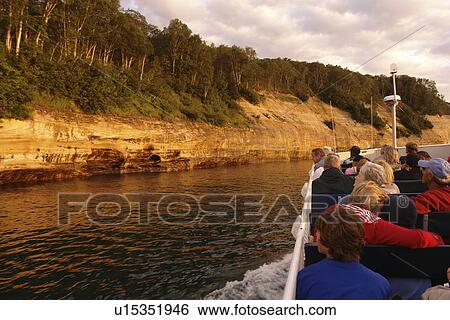 Munsing, MI, Michigan, Upper Peninsula, Lake Superior, Pictured Rocks Boat Cruise, Pictured Rocks National Lakeshore, sunset, passengers, open deck View Large Photo Image Stock Photograph - Munsing, MI, Michigan, Upper Peninsula, Lake Superior, Pictured Rocks Boat Cruise, Pictured Rocks National Lakeshore, sunset, passengers, open deck. Fotosearch