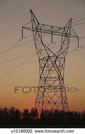 Stock Image -  ND, North Dakota, Power Lines, sunset. Fotosearch