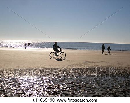 people biking and walking on the beach, Hilton Head Island, Low Country, South Carolina, SC, Atlantic Ocean View Large Photo Image Stock Image - people biking and walking on the beach, Hilton Head Island, Low Country, South Carolina, SC, Atlantic Ocean. Fotosearch