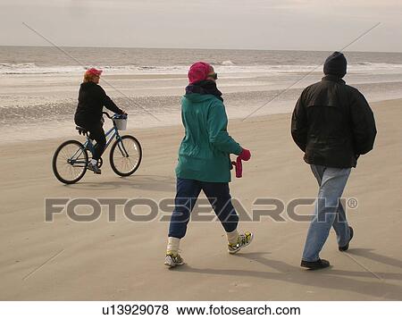 people biking and walking on the beach, Hilton Head Island, Low Country, South Carolina, SC, Atlantic Ocean View Large Photo Image Stock Photo - people biking and walking on the beach, Hilton Head Island, Low Country, South Carolina, SC, Atlantic Ocean. Fotosearch