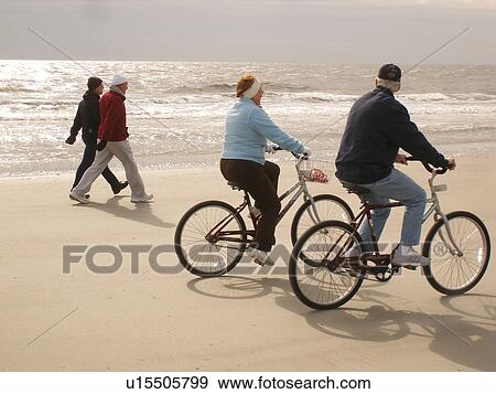people biking and walking on the beach, Hilton Head Island, Low Country, South Carolina, SC, Atlantic Ocean View Large Photo Image Stock Photo - people biking and walking on the beach, Hilton Head Island, Low Country, South Carolina, SC, Atlantic Ocean. Fotosearch
