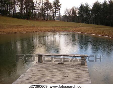 Stock Photo -  pond, ice forming, wooden dock, Galax, Virginia, VA, Blue Ridge Parkway. Fotosearch