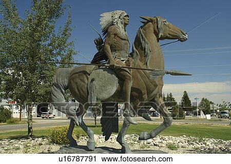Stock Image -  Red Lodge, MT, Montana, statue of Indian on horseback. Fotosearch