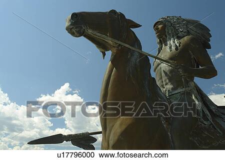 Stock Image -  Red Lodge, MT, Montana, statue of Indian on horseback. Fotosearch
