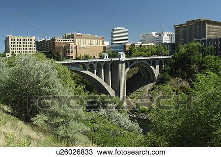 Stock Image -  Spokane, WA, Washington, downtown, skyline, Monroe Street Bridge, Spokane River. Fotosearch