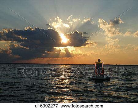 sunset, border crossing buoy, Lake Champlain, St Albans, VT, Vermont, Canadian Border View Large Photo Image Stock Photo - sunset, border crossing buoy, Lake Champlain, St Albans, VT, Vermont, Canadian Border. Fotosearch