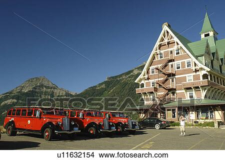 Waterton Lakes National Park, Alberta, Canada, Rocky Mountains, Prince of Wales Hotel, Upper Waterton Lake, red jammer tour buses View Large Photo Image Picture - Waterton Lakes National Park, Alberta, Canada, Rocky Mountains, Prince of Wales Hotel, Upper Waterton Lake, red jammer tour buses. Fotosearch