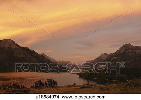 Waterton Lakes National Park, Alberta, Canada, Rocky Mountains, Prince of Wales Hotel, Upper and Middle Waterton Lakes, sunrise View Large Photo Image Picture - Waterton Lakes National Park, Alberta, Canada, Rocky Mountains, Prince of Wales Hotel, Upper and Middle Waterton Lakes, sunrise. Fotosearch