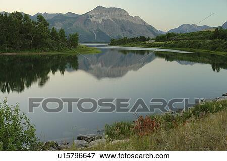 Stock Photo -  Waterton Lakes National Park, Alberta, Canada, Rocky Mountains, Lower Waterton Lake, sunset. Fotosearch