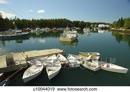 Stock Photo -  Winter Harbor, ME, Maine, fishing harbor, dock, dinghies. Fotosearch