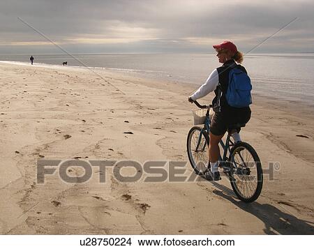 woman biking on the beach, Hilton Head Island, Low Country, South Carolina, SC, Atlantic Ocean View Large Photo Image Picture - woman biking on the beach, Hilton Head Island, Low Country, South Carolina, SC, Atlantic Ocean. Fotosearch