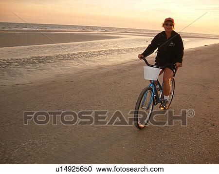 woman biking on the beach, Hilton Head Island, Low Country, South Carolina, SC, Atlantic Ocean View Large Photo Image Stock Image - woman biking on the beach, Hilton Head Island, Low Country, South Carolina, SC, Atlantic Ocean. Fotosearch