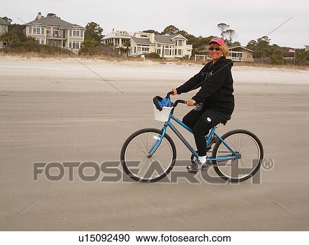 woman biking on the beach, Hilton Head Island, Low Country, South Carolina, SC, Atlantic Ocean View Large Photo Image Stock Image - woman biking on the beach, Hilton Head Island, Low Country, South Carolina, SC, Atlantic Ocean. Fotosearch