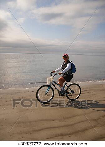 woman biking on the beach, Hilton Head Island, Low Country, South Carolina, SC, Atlantic Ocean View Large Photo Image Stock Image - woman biking on the beach, Hilton Head Island, Low Country, South Carolina, SC, Atlantic Ocean. Fotosearch