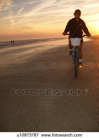 woman biking on the beach, Hilton Head Island, Low Country, South Carolina, SC, Atlantic Ocean View Large Photo Image Stock Photo - woman biking on the beach, Hilton Head Island, Low Country, South Carolina, SC, Atlantic Ocean. Fotosearch